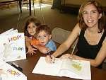 Corey at a local book signing for Hop! Plop!