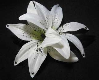 two white tiger lilies back to back on an alligator clip black beads 