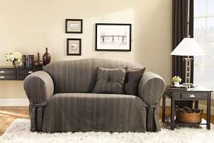 Sofa with grey fitted slipcover dresses up living room