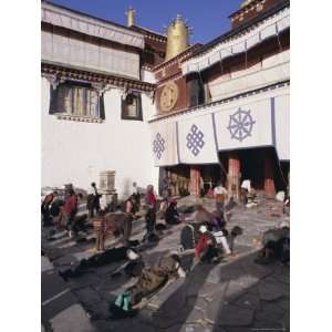Pilgrims Prostrating Outside the Jokhang Temple, Lhasa, Tibet, China 